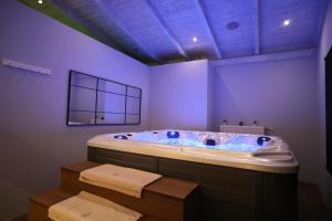 a bathroom with a jacuzzi tub in a room at Filoxenia Hotel & Spa in Kalavrita +149 photos