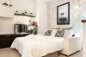 Ένα ή περισσότερα κρεβάτια σε δωμάτιο στο Bilocale moderno a Bollate vicino a Fieramilano e Milano Ice Park