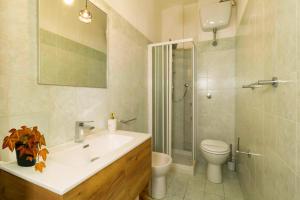 a bathroom with a sink and a toilet and a shower at Casa Violante in Ancona