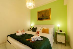 a bedroom with a bed with stuffed animals on it at Casa Violante in Ancona