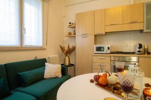 a living room with a table and a couch at Casa Violante in Ancona +22 photos