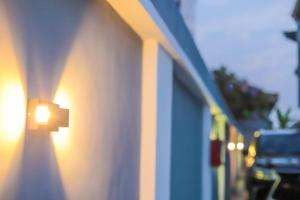 a street light on the side of a building at HOMEWORTH SPACES - Shortlet Apartmemt in Alimosho