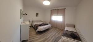 Postel nebo postele na pokoji v ubytování Villa Manolita + 4 fotografie