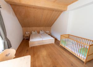 Ένα ή περισσότερα κρεβάτια σε δωμάτιο στο JAUCHZA! Berg Apartments mit 360 Grad Blick