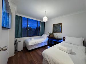 Ένα ή περισσότερα κρεβάτια σε δωμάτιο στο Garden Gallery - Tranquil Luxury Retreat +47 φωτογραφίες