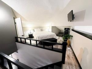 a bedroom with a white bed and a balcony at Lakefront Home-3bd25badockgrillfirepitpool in Arrowhead Beach +86 photos