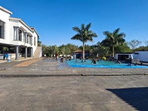 a group of people on a pool in a courtyard at The Private Location in Thohoyandou