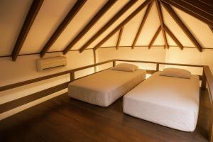 Postel nebo postele na pokoji v ubytování Redang Divers Resort