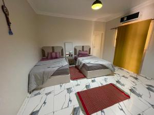 Postel nebo postele na pokoji v ubytování Nubian Villa with Private Pool + 12 fotografií