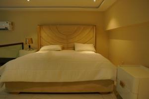 Postel nebo postele na pokoji v ubytování Amanah Serviced Apartments + 52 fotografií