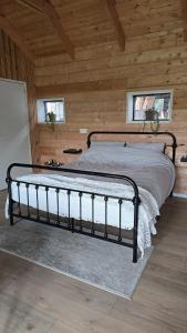 Postel nebo postele na pokoji v ubytování Lodge Klein Ganseij