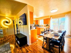 a kitchen and dining room with a table and chairs at Spacious Ski Base Near The Best Resorts in Salt Lake City