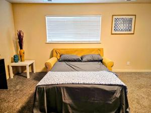 a bedroom with a large bed with a window at Spacious Ski Base Near The Best Resorts in Salt Lake City