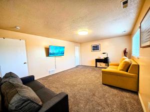 a living room with a couch and a chair at Spacious Ski Base Near The Best Resorts in Salt Lake City