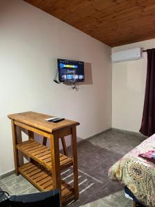 Μια τηλεόραση ή/και κέντρο ψυχαγωγίας στο Hotel Complejo Del Carmen San Bernardo