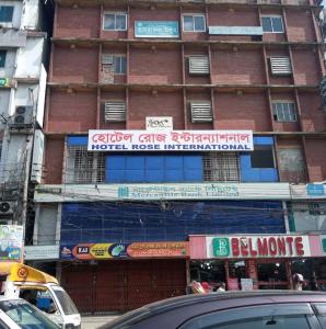 a building under construction with a sign on it at Hotel Rose International in Dhaka