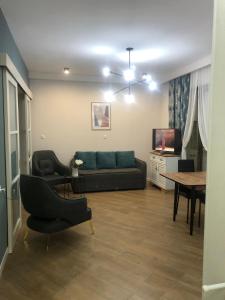 TV a/nebo společenská místnost v ubytování the best apartment