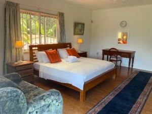 Ένα ή περισσότερα κρεβάτια σε δωμάτιο στο The Orchard Holiday Home +135 φωτογραφίες