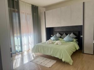 a bedroom with a bed with two towels on it at Casa La Perla in Montevarchi