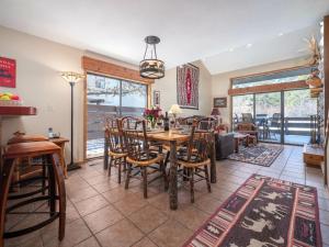 a dining room with a table and chairs at RMR: Primrose 1711 Condo in The AspensWilsonWY in Wilson