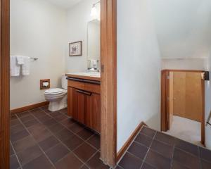 a bathroom with a toilet and a sink at RMR: Wheatgrass 2212 Condo in The AspensWilsonWY in Wilson +12 photos