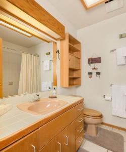 a bathroom with a sink and a toilet at RMR: Wind River 15 Condo in Teton Village in Teton Village