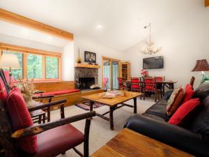 a living room with a couch and a table at RMR: Strawberry 3922 Condo in The AspensWilsonWY in Wilson