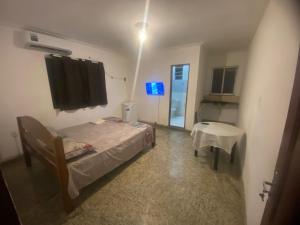 a hospital room with a bed and a table at Cop 30 in Belém