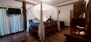 Postel nebo postele na pokoji v ubytování Srichaiyapura Wellness Resort