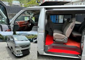 a van with the doors open and a small car inside at On My way Tours and travels in Colombo