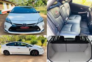 a white car with the back doors open at On My way Tours and travels in Colombo