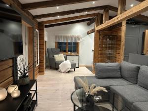a living room with a couch and a table at Cozy cabin with an amazing view in Åre