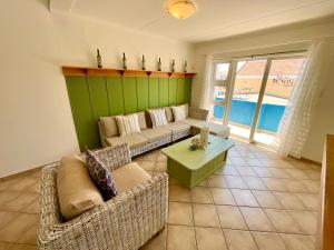 a living room with a couch and a table at Sealavie Central Apartment in Khomas Region