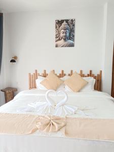 Postel nebo postele na pokoji v ubytování Marine House Koh Tao