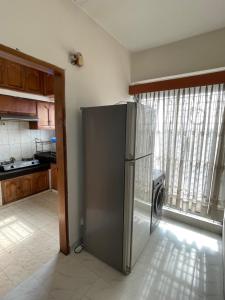 Kuchyň nebo kuchyňský kout v ubytování Apartment in the Heart of Dhaka