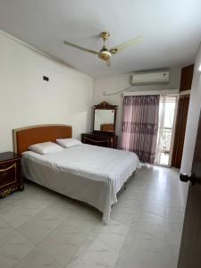 Postel nebo postele na pokoji v ubytování Apartment in the Heart of Dhaka