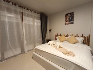 Postel nebo postele na pokoji v ubytování Marine House Koh Tao