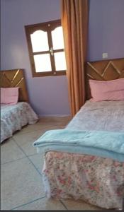 Ένα ή περισσότερα κρεβάτια σε δωμάτιο στο Spacious apartment for families near Ouzoud Falls +2 φωτογραφίες