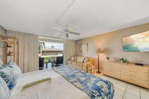 a bedroom with a bed and a living room at Eldorado D106 · EL D106 Relaxing Kaanapali Condo w Pool AC Beach in Kahana +43 photos