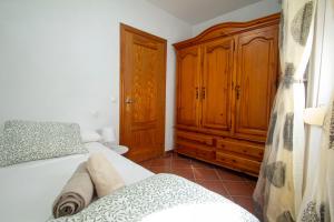 En eller flere senge i et værelse på Casa Centro Los Remedios