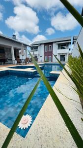 a view of a swimming pool at a hotel at Casa 3 suítes Salinas in Salinópolis