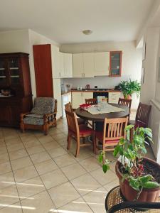 a kitchen and dining room with a table and chairs at Bed&Breakfast Castagna in Carlopoli