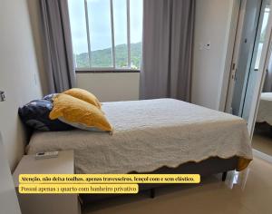 Ένα ή περισσότερα κρεβάτια σε δωμάτιο στο Cobertura em Bombinhas - Piscina - Luxo - Alto Padrão +51 φωτογραφίες