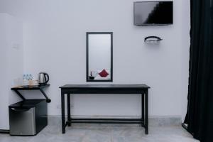 a black table with a mirror on top of it at Auraya Ella in Ella
