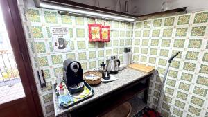 a kitchen with a counter with a tea kettle on it at B&E Casa Vacanze in Taranto