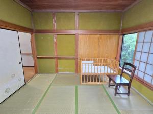 Postel nebo postele na pokoji v ubytování いすみエンガワのある古民家