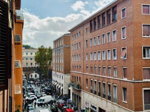 a busy city street filled with cars and buildings at Borgo Pio Suite Apartment in Rome