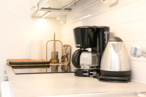 a coffee maker sitting on a counter in a kitchen at Arctic Willamo Studio- Rovaniemi in Rovaniemi