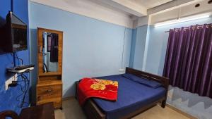 Ένα ή περισσότερα κρεβάτια σε δωμάτιο στο Mountain Drizzle Rooms