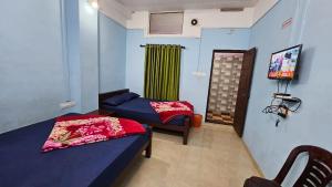 Ένα ή περισσότερα κρεβάτια σε δωμάτιο στο Mountain Drizzle Rooms